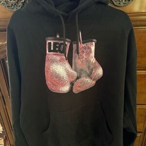Monaleo On Tour Black Hoodie with Boxing Gloves Graphic and tour dates on back.